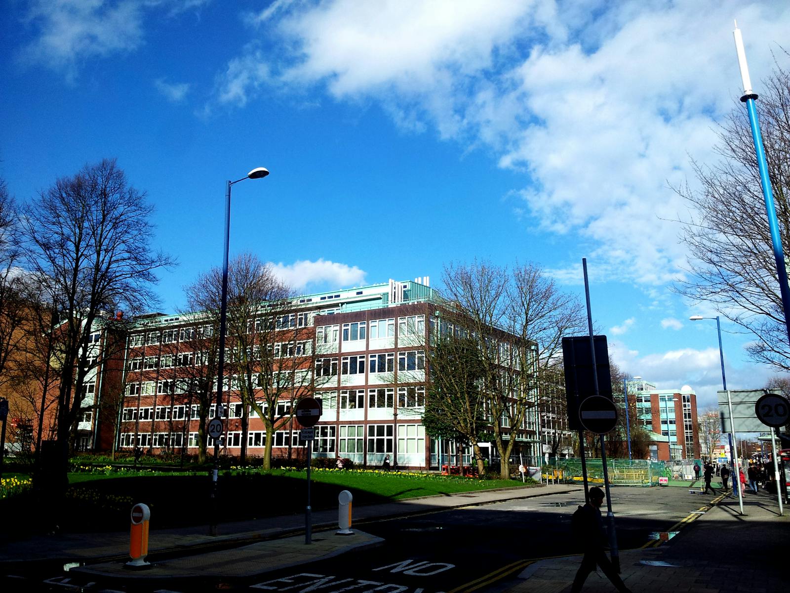 A modern building with clear blue skies in an urban setting, perfect for business and cityscape themes.